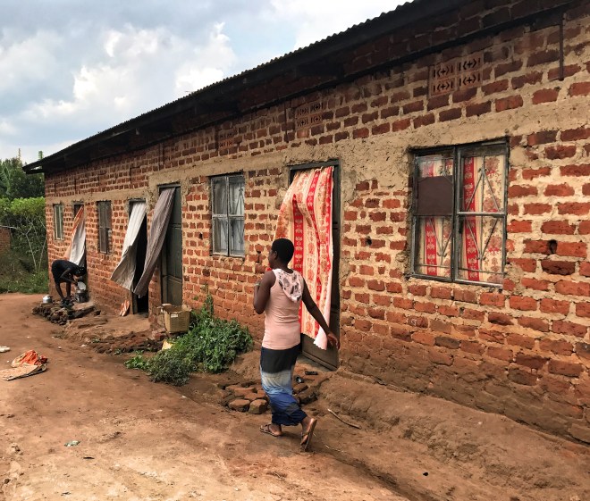 brick jinja woman walking Fotor
